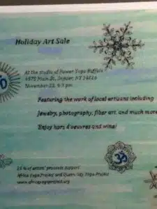 Holiday Art Sale flyer with snowflakes design.