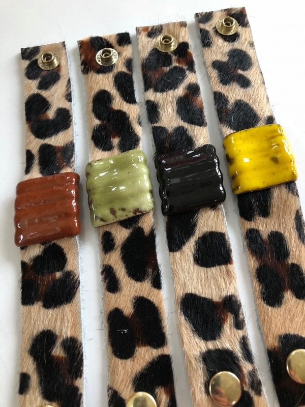 Four leopard print straps with colorful ceramic square beads.
