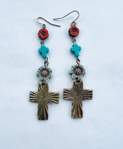 Colorful cross earrings with floral and turquoise accents.