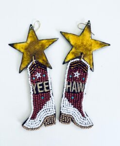 Pair of beaded cowboy boot earrings with yellow stars and text.