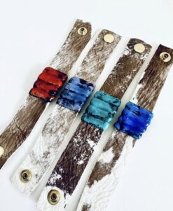Four cowhide leather bracelets with colorful ceramic beads and snap buttons.