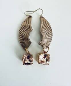 Elegant wing-shaped earrings with sparkling square gemstones.