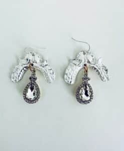 Elegant silver and crystal drop earrings with intricate detailing.