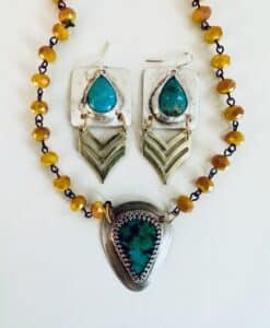 Turquoise and silver jewelry set with amber beads.