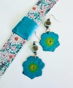 Floral-themed turquoise earrings with matching fabric bracelet.
