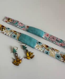Floral fabric straps and bird-shaped earrings with tassels.