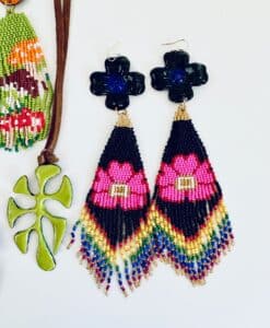 Colorful beaded earrings with floral design and a green leaf pendant.