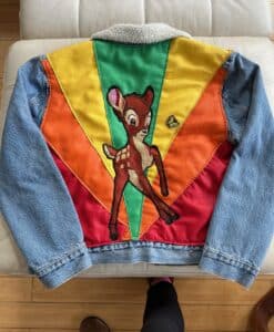 Denim jacket with colorful Bambi design on the back.
