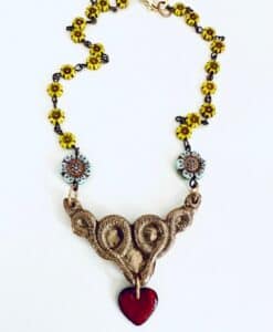Elegant necklace with intricate design and floral chain.