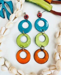 Colorful circular dangle earrings in blue, green, and orange.