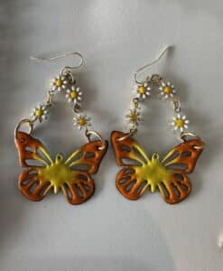 Orange-yellow butterfly earrings with daisy chain