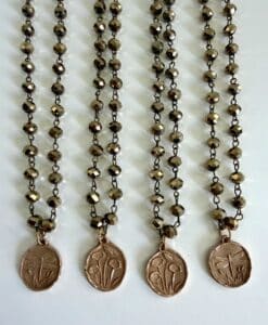 Four beaded necklaces with floral medallions
